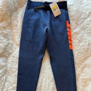 Nike Kids Dark Blue Joggers with Bright Orange Detail